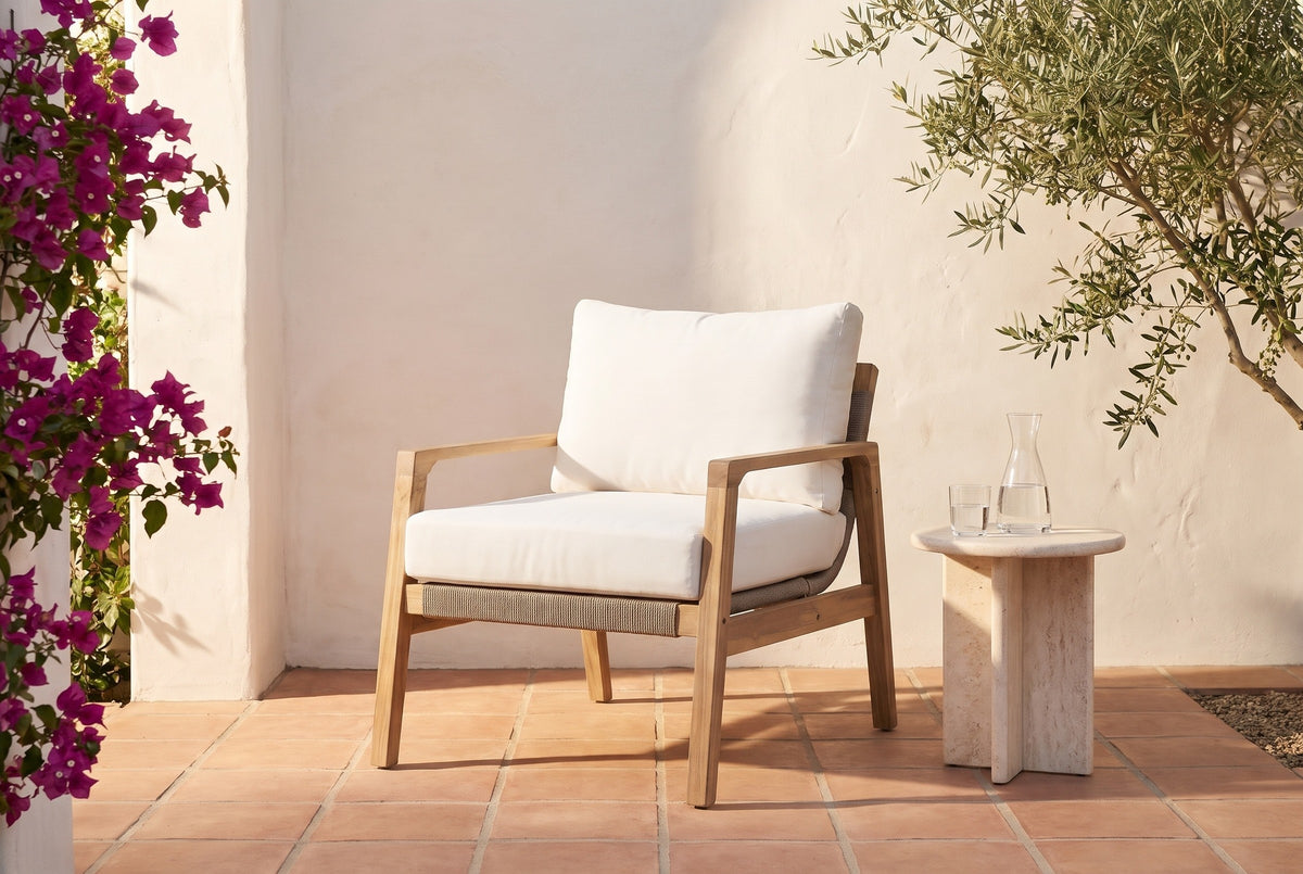 Niscemi acacia rope club chair in a Santa Barbara courtyard at golden hour, a white limewashed wall, bougainvillea and terracotta tiles (side table not included)