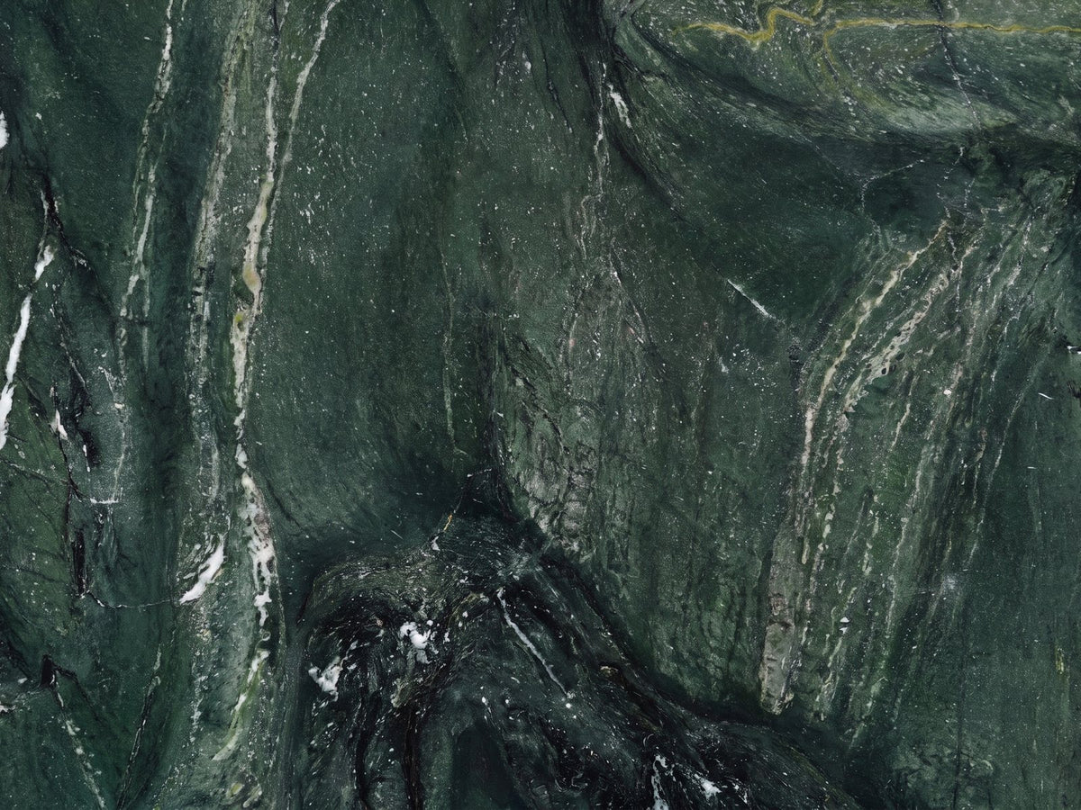 Close-up of the Orosei Verde Marble Coffee Table: the veining of the polished green marble top