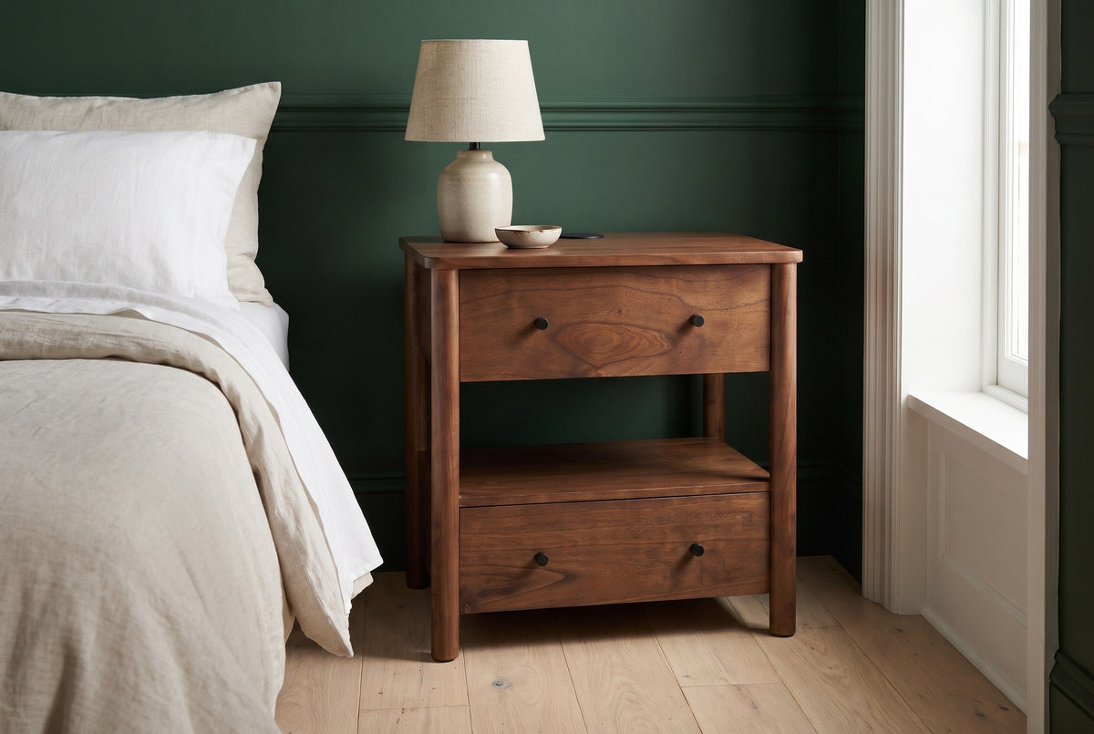 Palau solid neem nightstand against a deep forest green wall in a Brooklyn brownstone bedroom with a pale oak floor