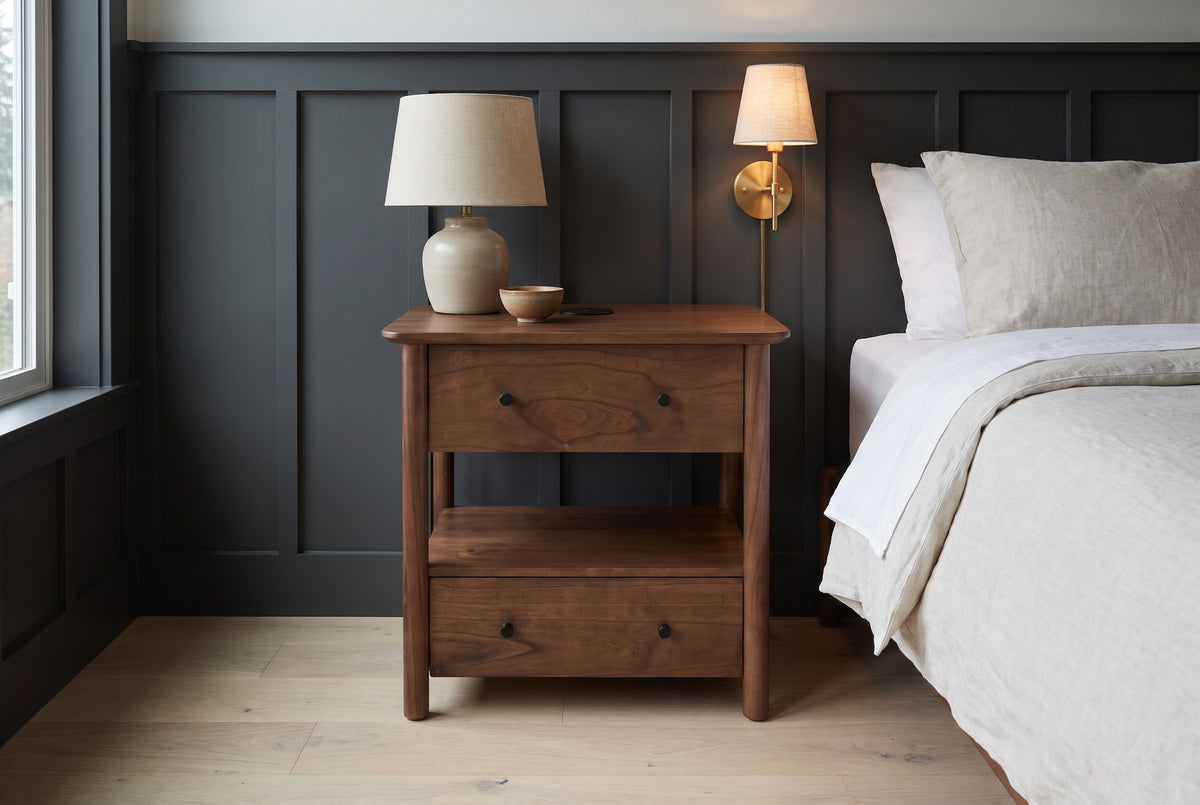 Palau solid neem nightstand against charcoal board-and-batten panelling in a Seattle bedroom with a brass wall light