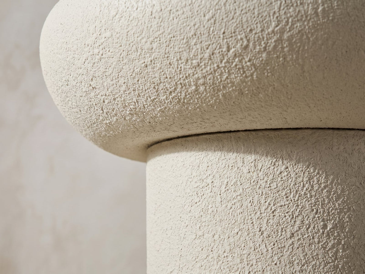 Close-up of the Pescocostanzo Cream Textured Fiberglass Mushroom Side Table: the rounded cap meeting the straight column