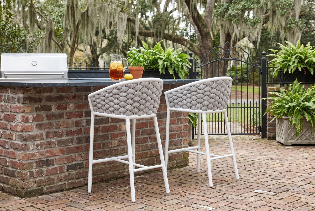 Two Petralia counter stools at a soapstone-topped brick counter in a Savannah courtyard, live oaks with Spanish moss and an iron gate behind (counter not included)