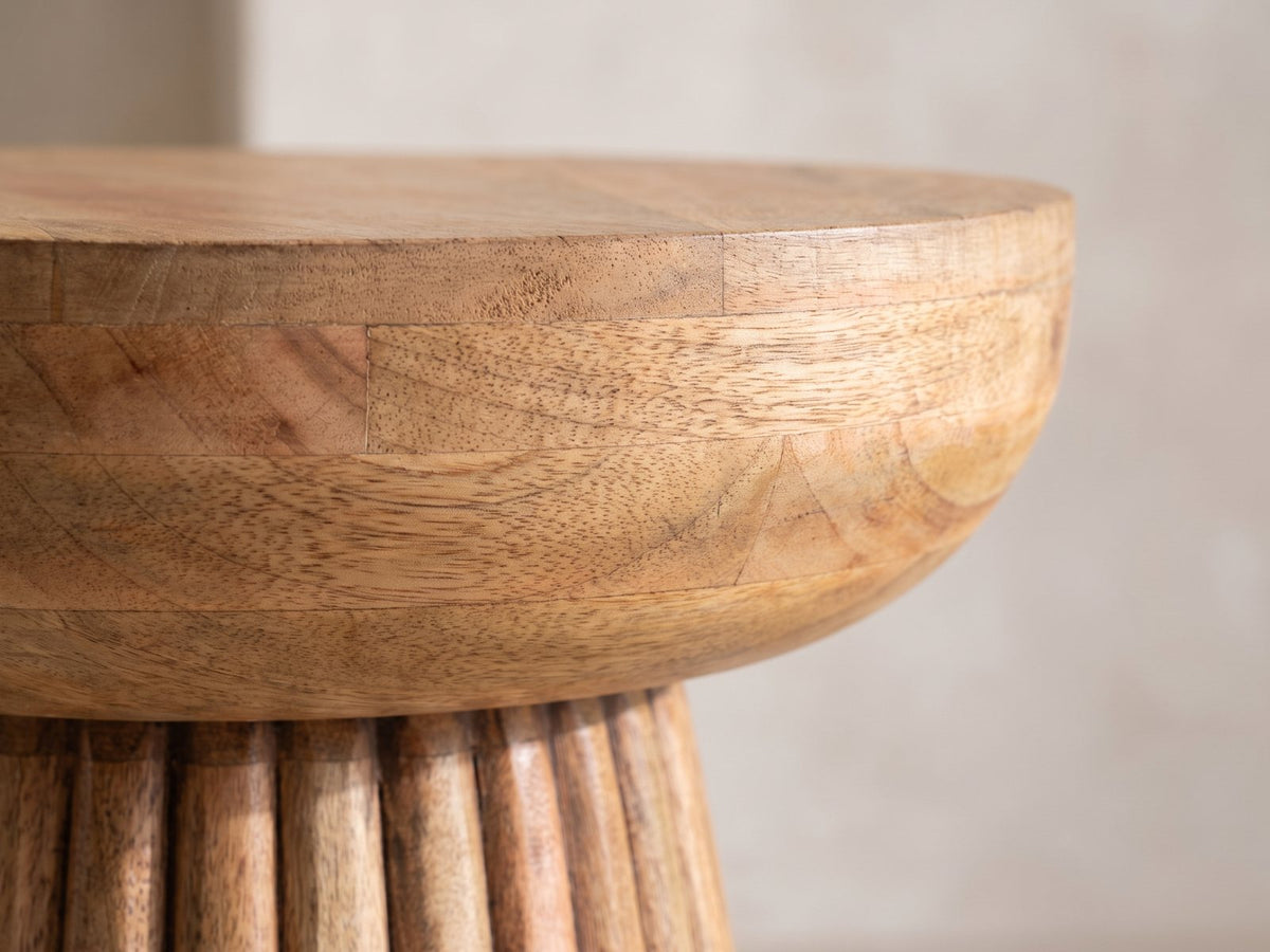 Close-up of the Petroio Fluted Mango Mushroom Side Table: the rounded mango cap over the fluted base