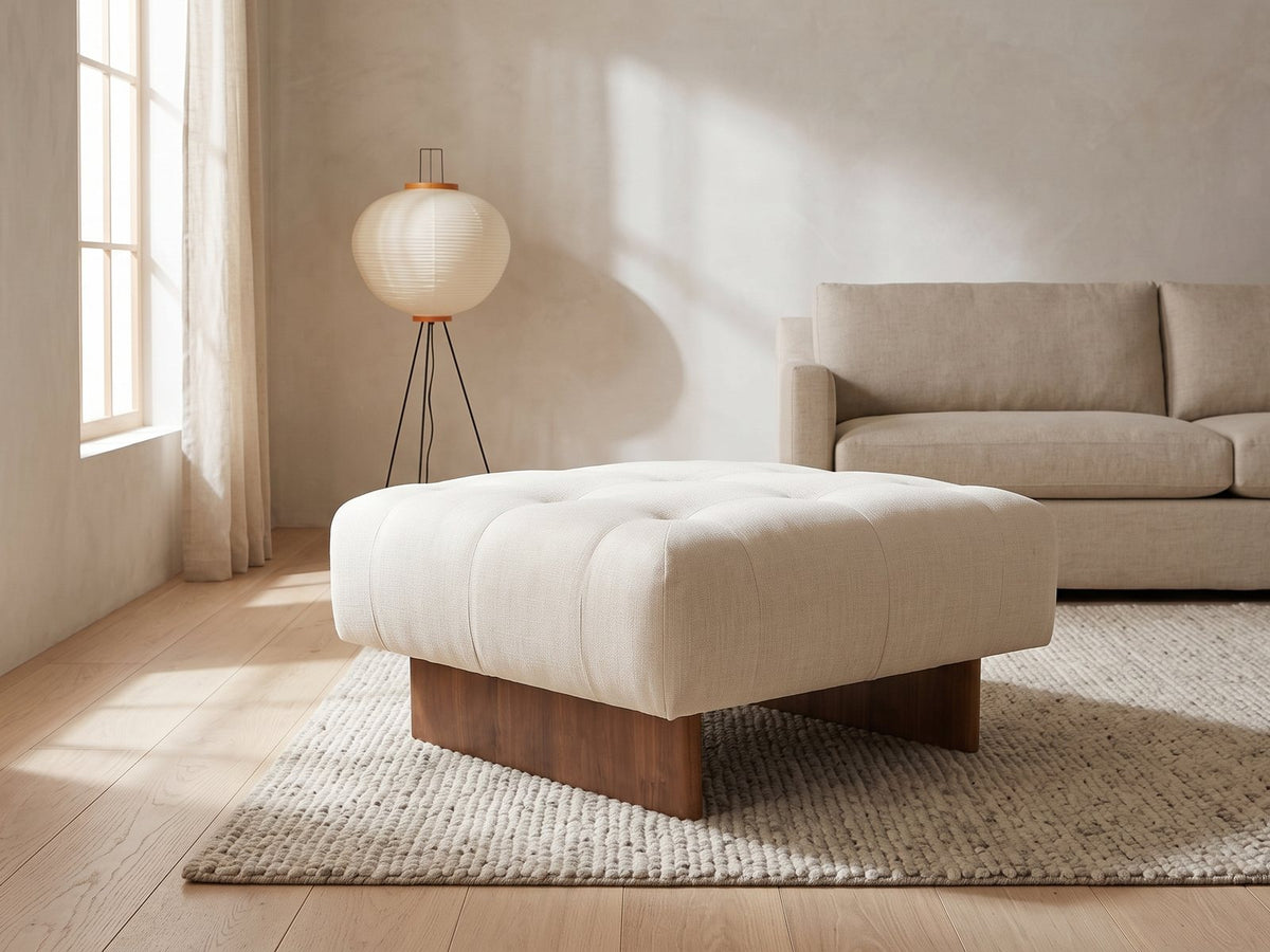 Pienza Tufted Ottoman in a furnished room