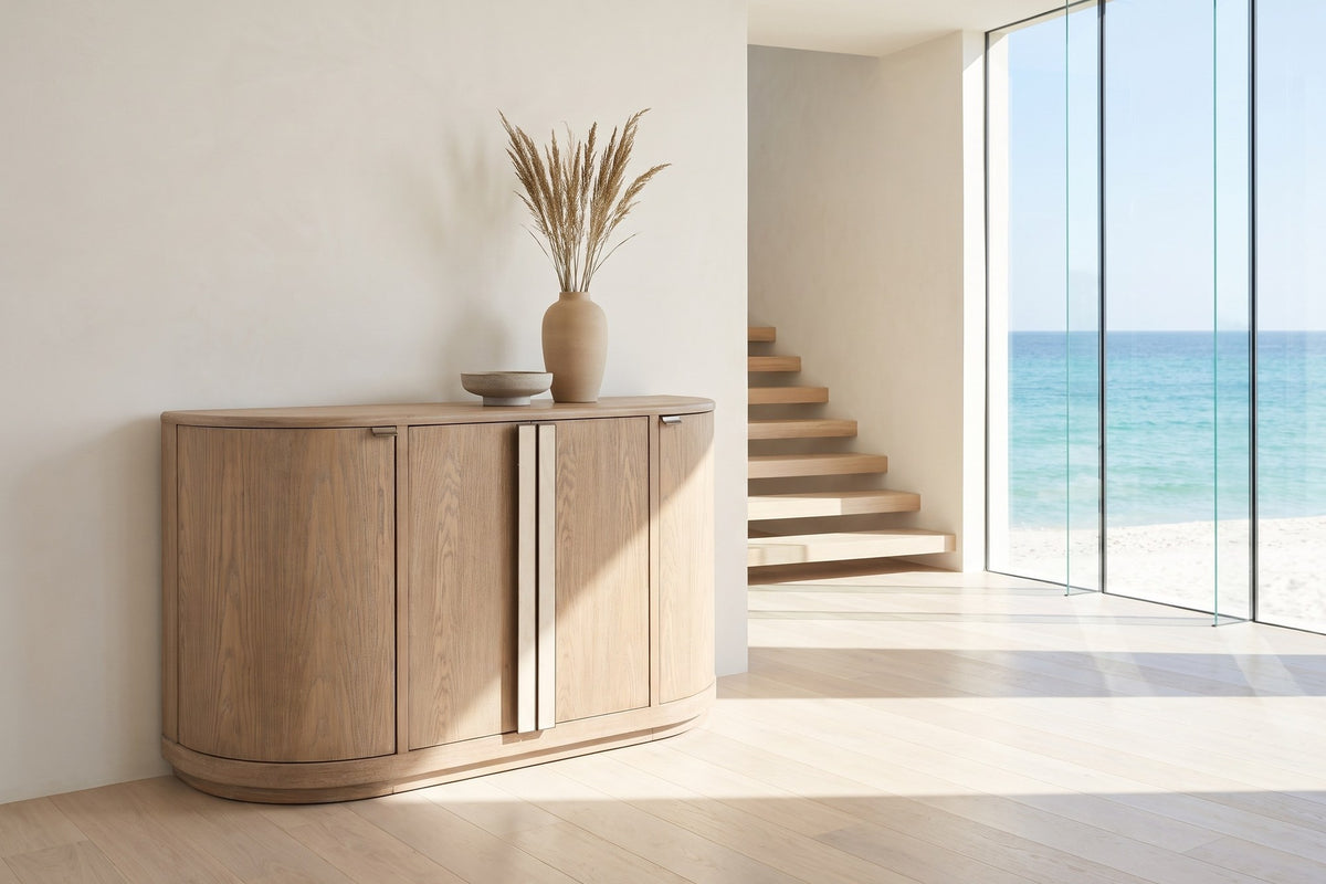 Pietrafitta 54-Inch 4-Door Rounded Oak Veneer Server with Stone Pulls in an oceanfront glass house