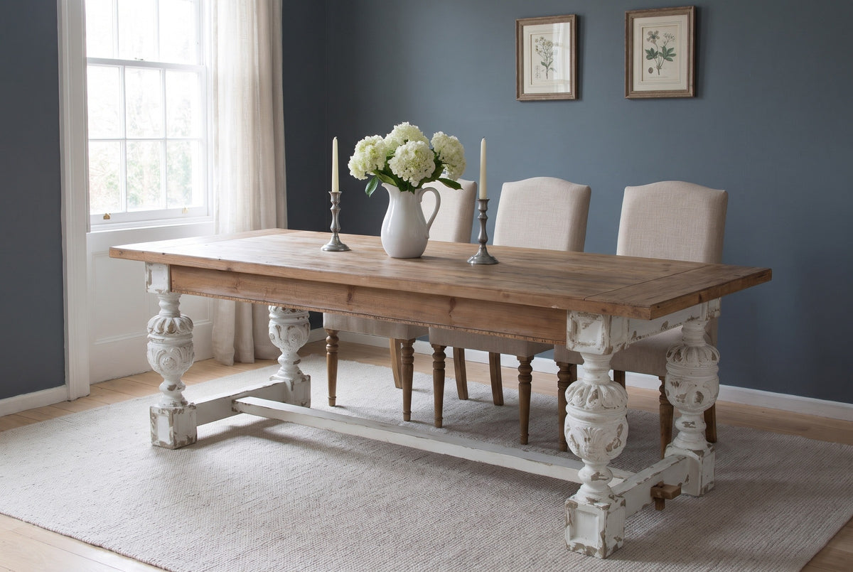 Policoro dining table with three linen chairs on the far side in a Charleston townhouse dining room with a slate blue-grey wall and pale oak floors