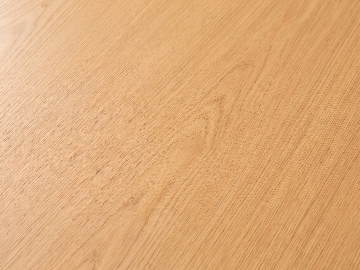 Close-up of the Pontedera Cane and Wood Round Side Table: the oak-tone wood grain of the round top
