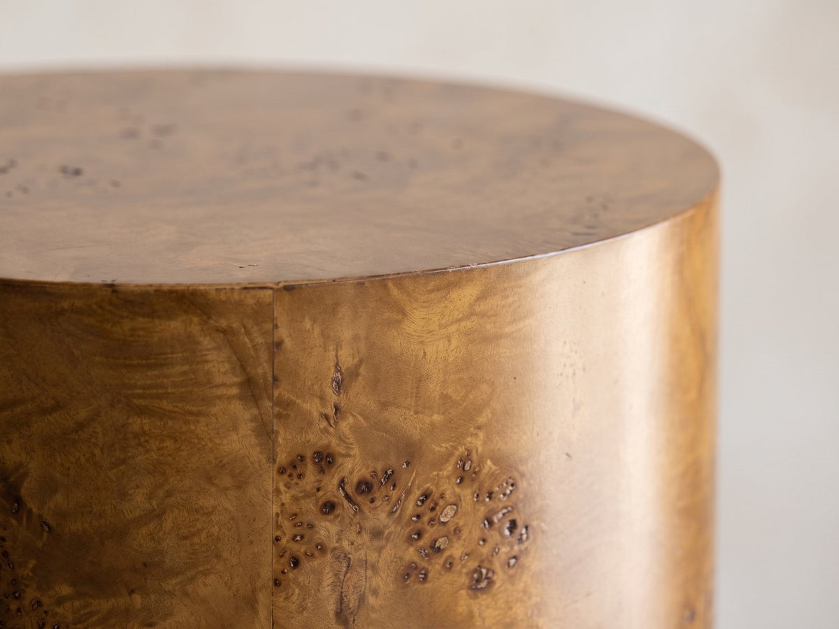 Close-up of the Potenza Walnut Burl Pillar Side Table: the crisp top edge of the walnut burl drum