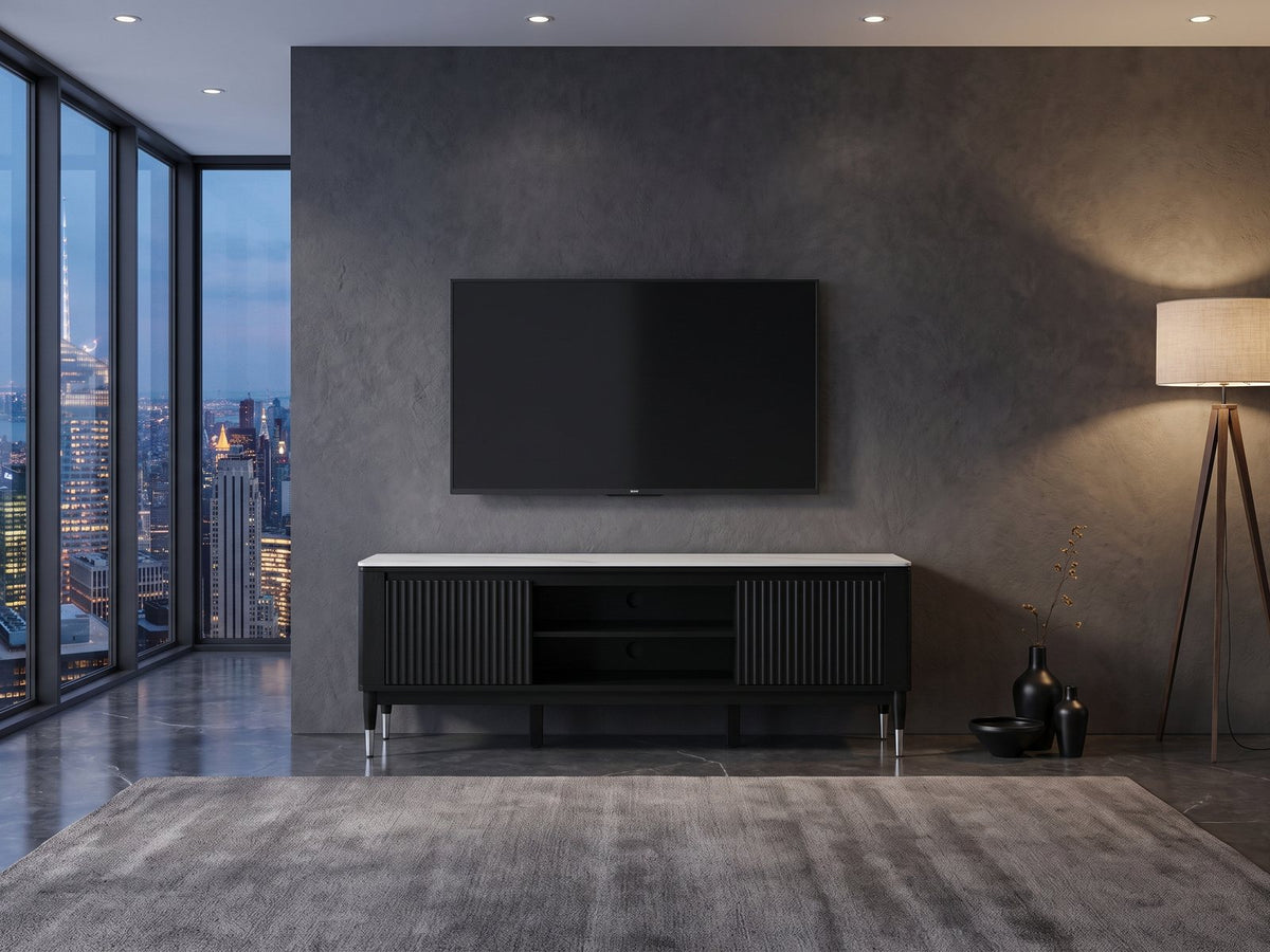Ragusa Stone Top Media Console under a wall-mounted screen in a city penthouse at blue hour