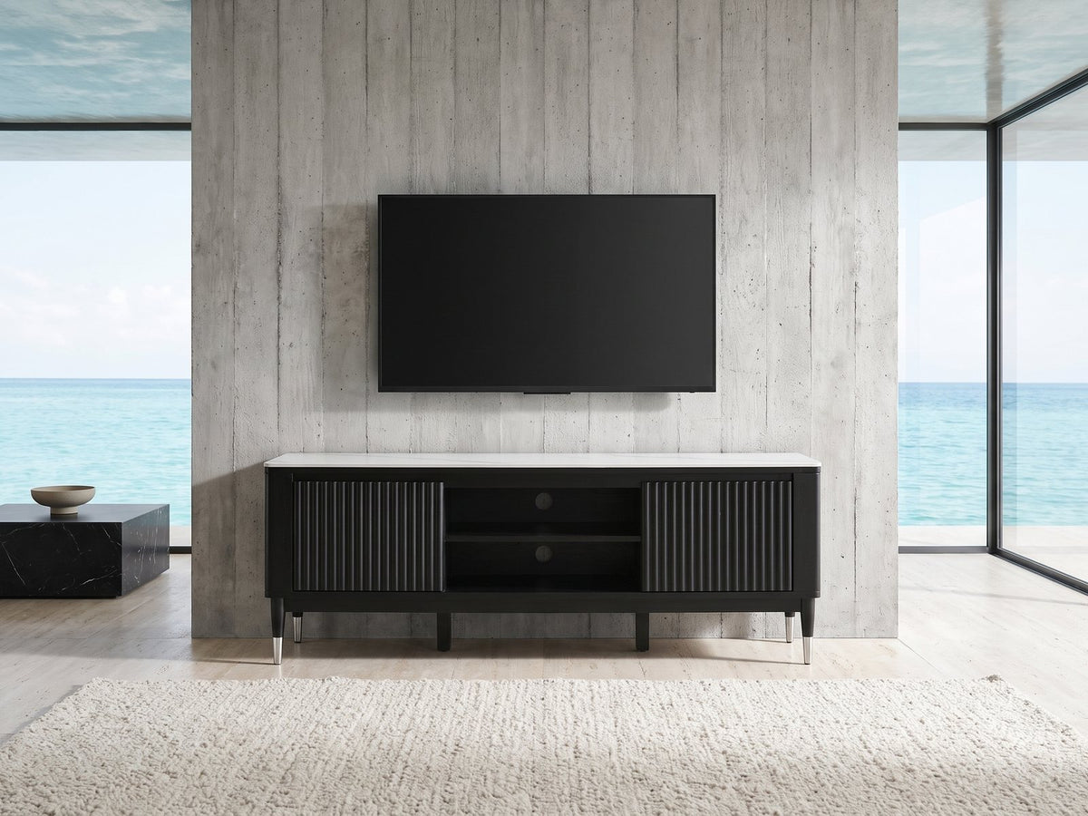 Ragusa Stone Top Media Console under a wall-mounted screen in an oceanfront glass house