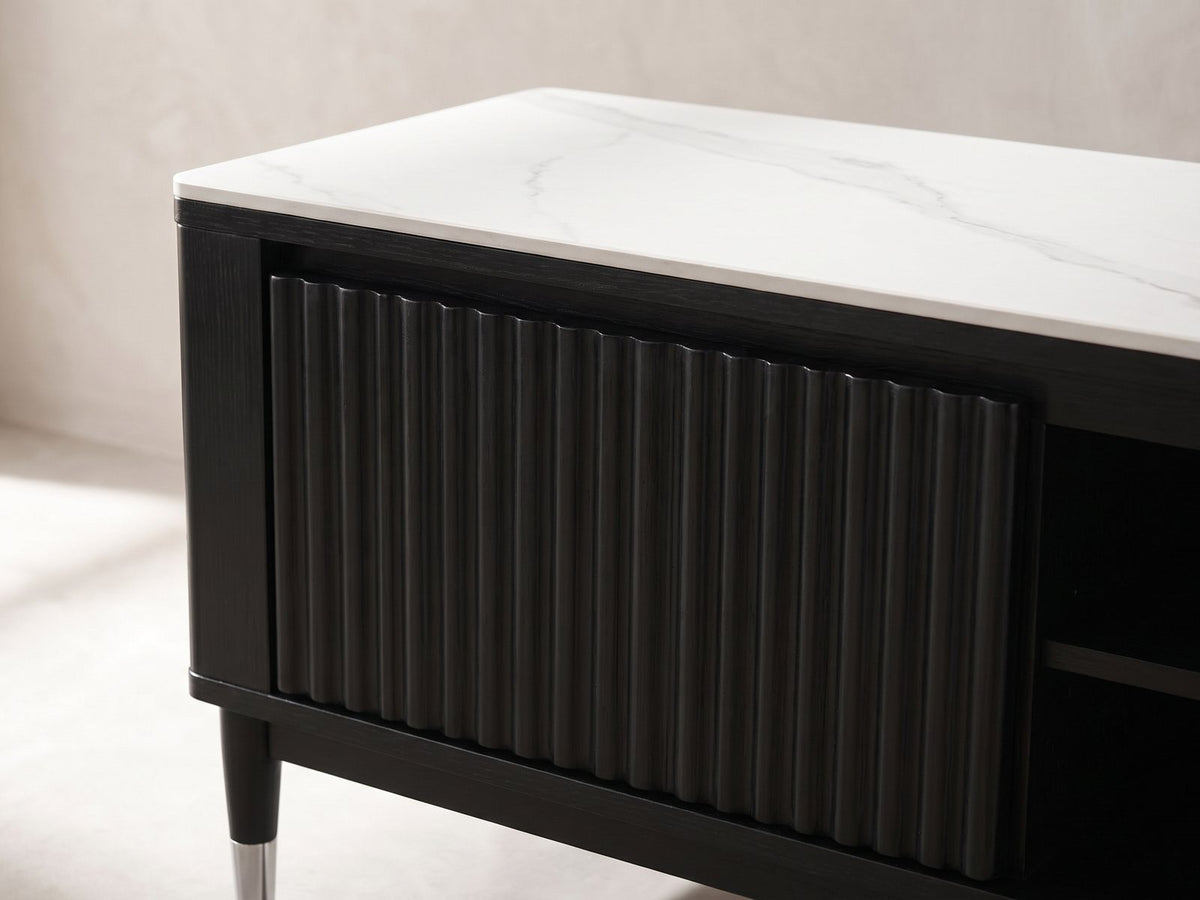 Close-up of the Ragusa Stone Top Media Console: the fluted black door front under the stone top