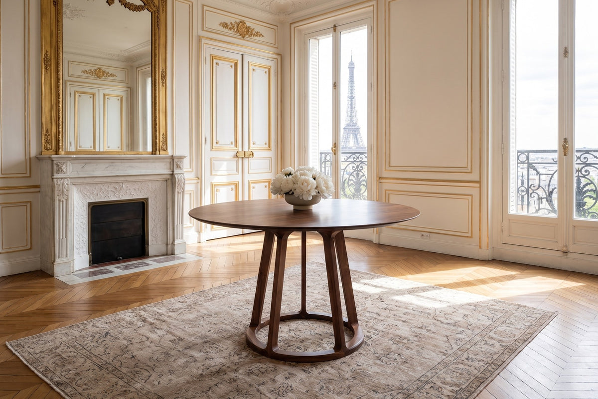 Riace 47-Inch Round Solid American Walnut Dining Table in a Paris salon