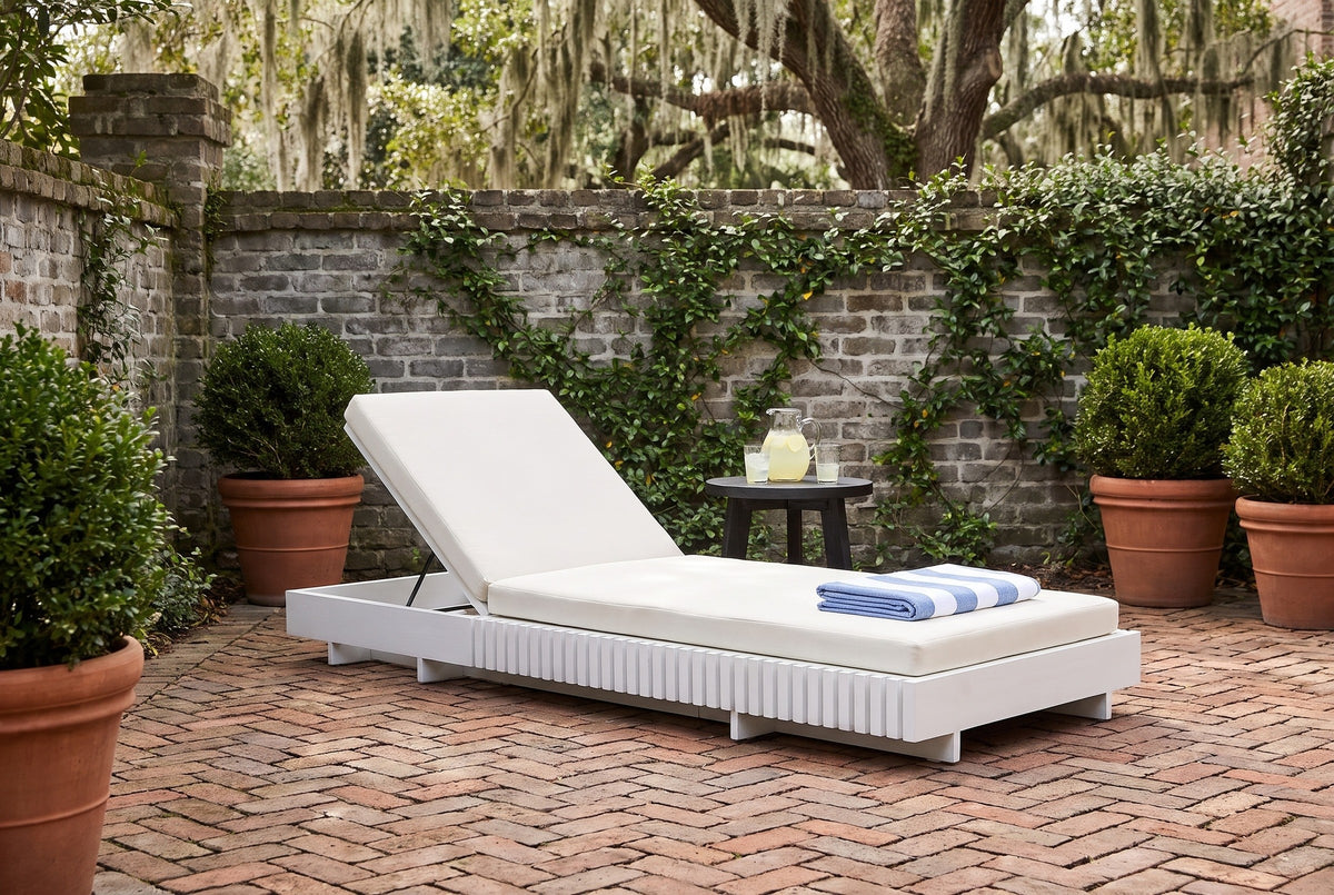 Riesi white acacia chaise in a walled Savannah courtyard with an old grey brick wall, ivy and a herringbone brick floor (side table not included)