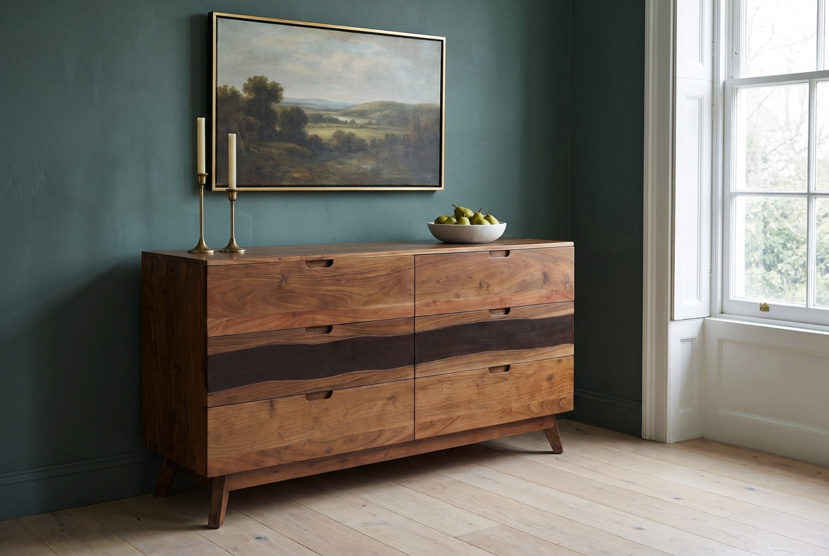 Rionero acacia sideboard with brass candlesticks and a bowl of pears in a Charleston townhouse dining room with a deep teal wall and pale oak floors
