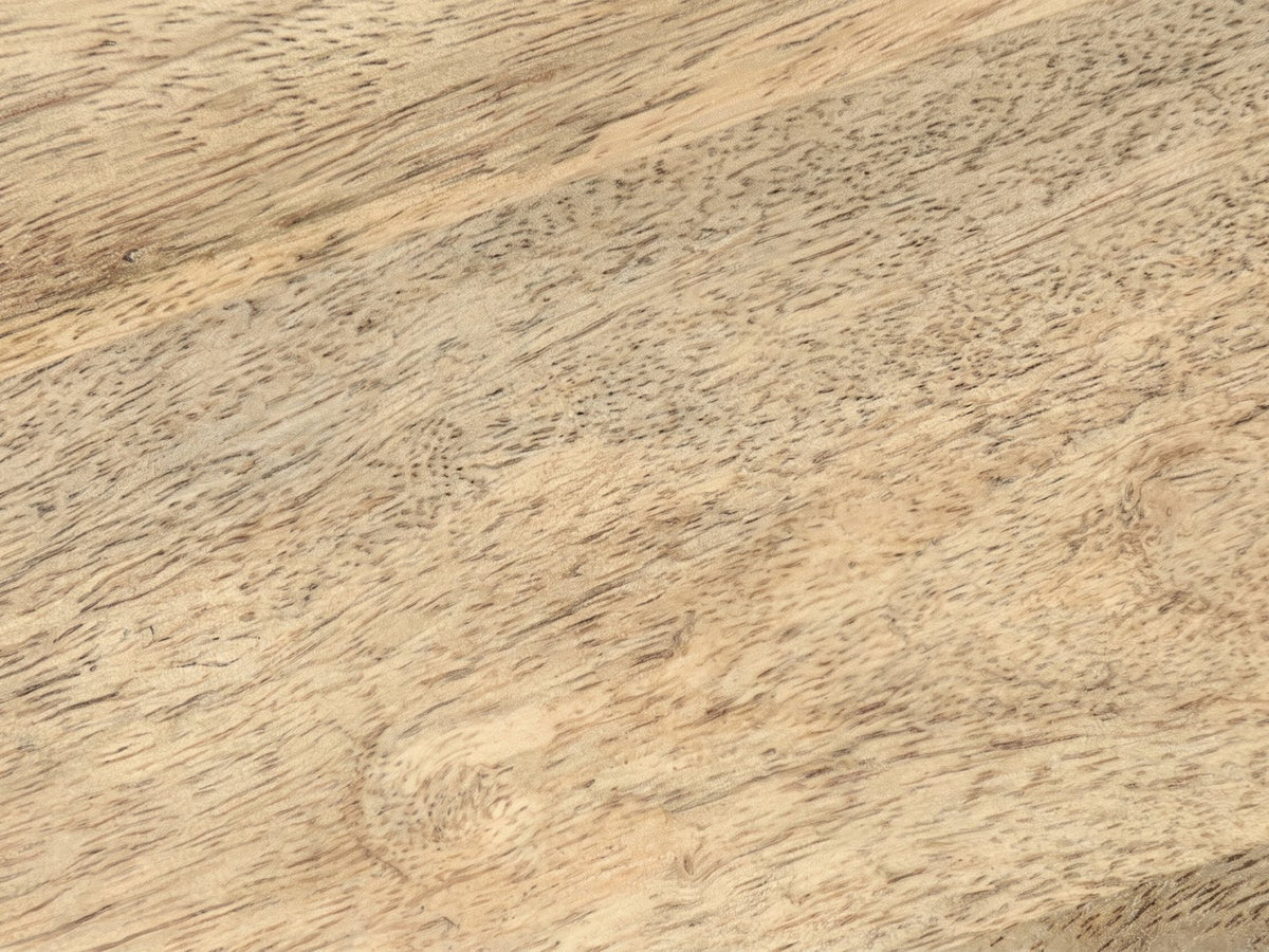 Close-up of the Rotondella Faceted Mango Drum Side Table: the natural mango grain of the top
