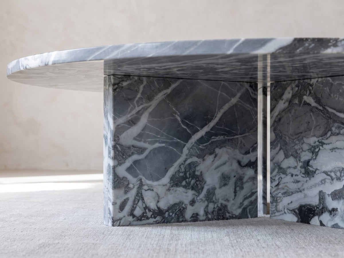 Close-up of the Saturnia Blue-Grey Marble Coffee Table: the two marble slabs of the base meeting under the top