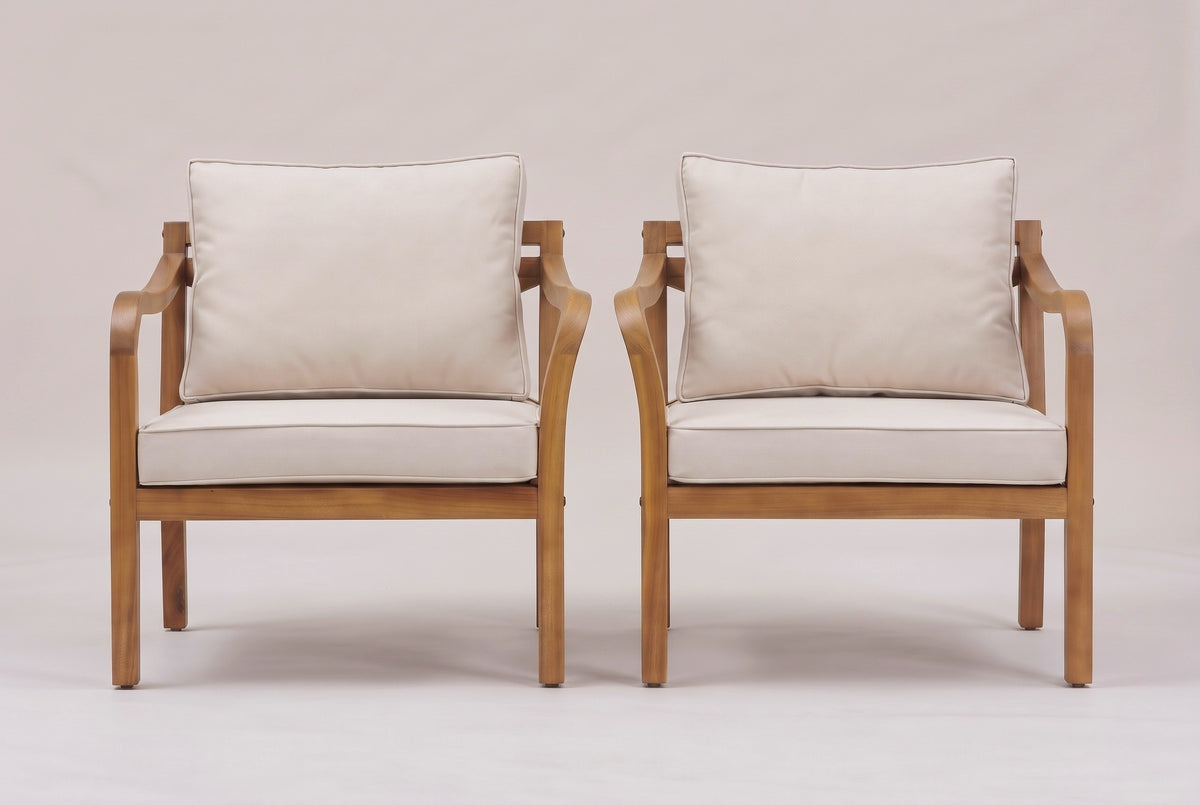 The two Savoca chairs from the front: square legs, deep seat rails and the curved arms on both sides