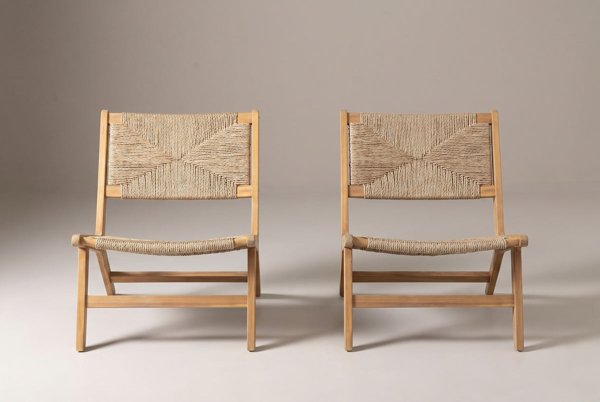 A Scopello lounge chair seen from the front: woven back, woven seat and low stretcher rails between the legs