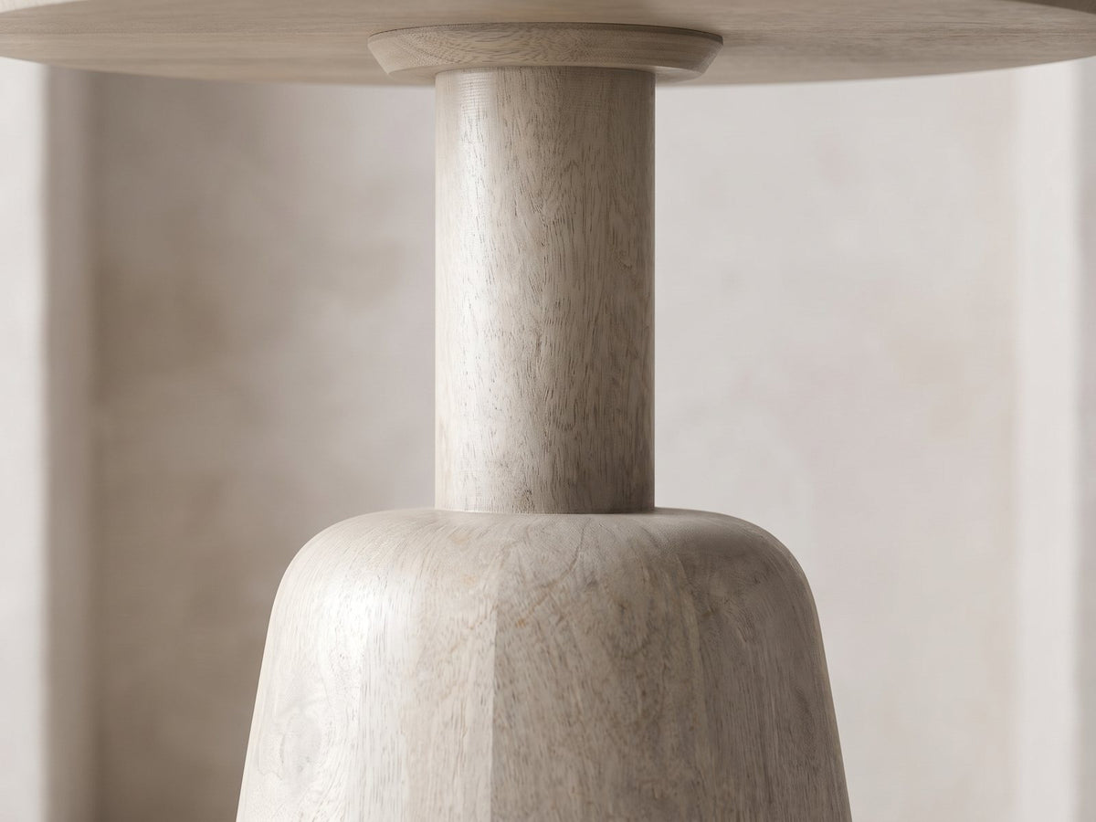 Close-up of the Segesta Whitewashed Mango Pedestal Side Table: the plain round column meeting the rounded shoulder of the cone base