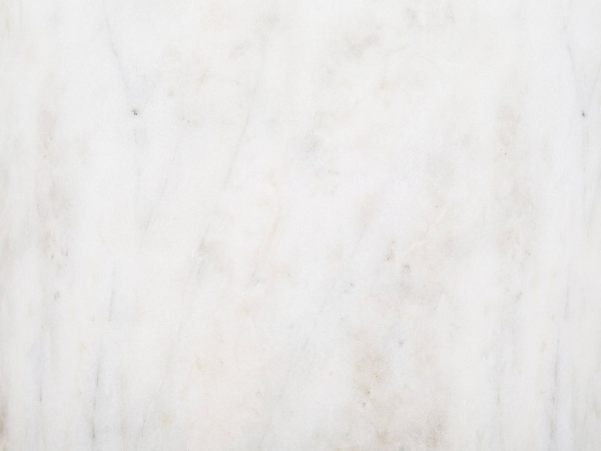 Close-up of the Seggiano Black Mango and Marble Drink Side Table: the white marble of the base