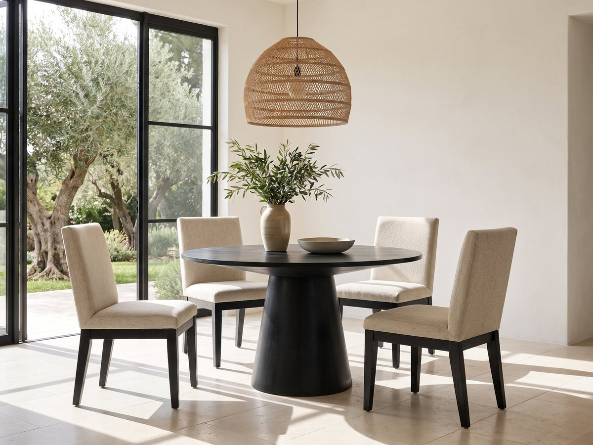 Sellia 59-Inch Round Ebony Cone Pedestal Dining Set with 4 Chairs in a sunlit villa dining area with olive trees outside