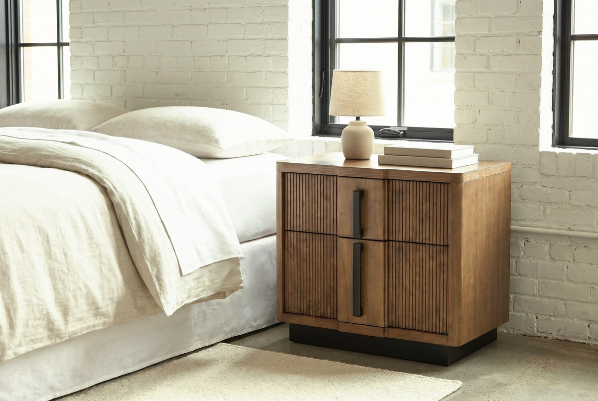 Senorbi ash brown nightstand with a ceramic lamp in a Denver loft bedroom with white painted brick and a concrete floor