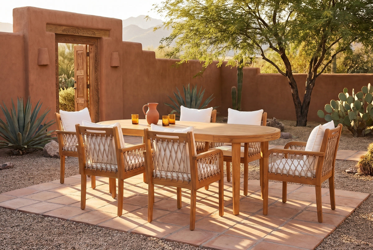 Siracusa acacia dining set with six rope armchairs on a saltillo tile patio in a Tucson desert courtyard with terracotta adobe walls and a mesquite tree (tableware not included)