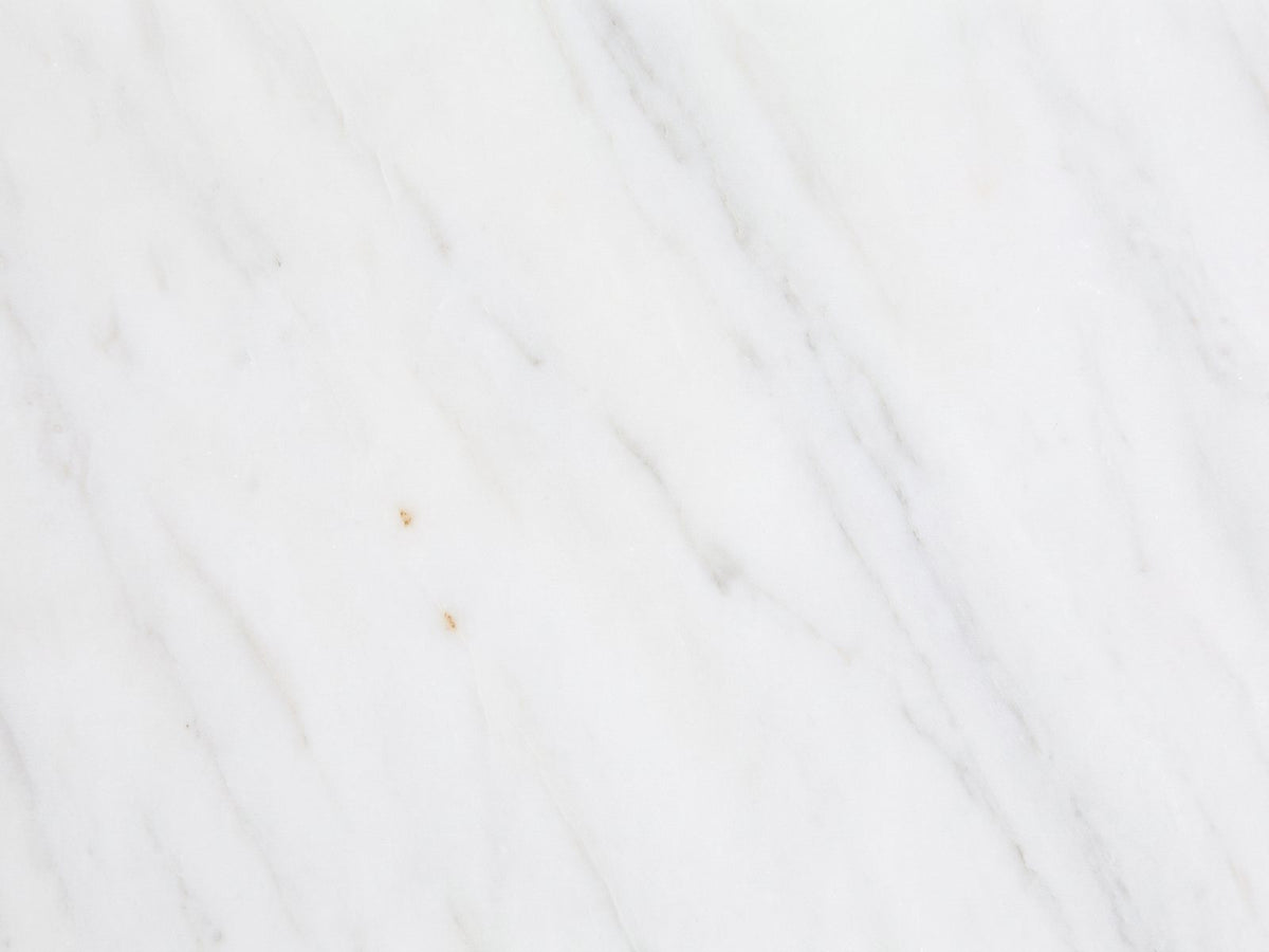 Close-up of the Soleto White Marble Ring-Base Side Table: the white marble of the top
