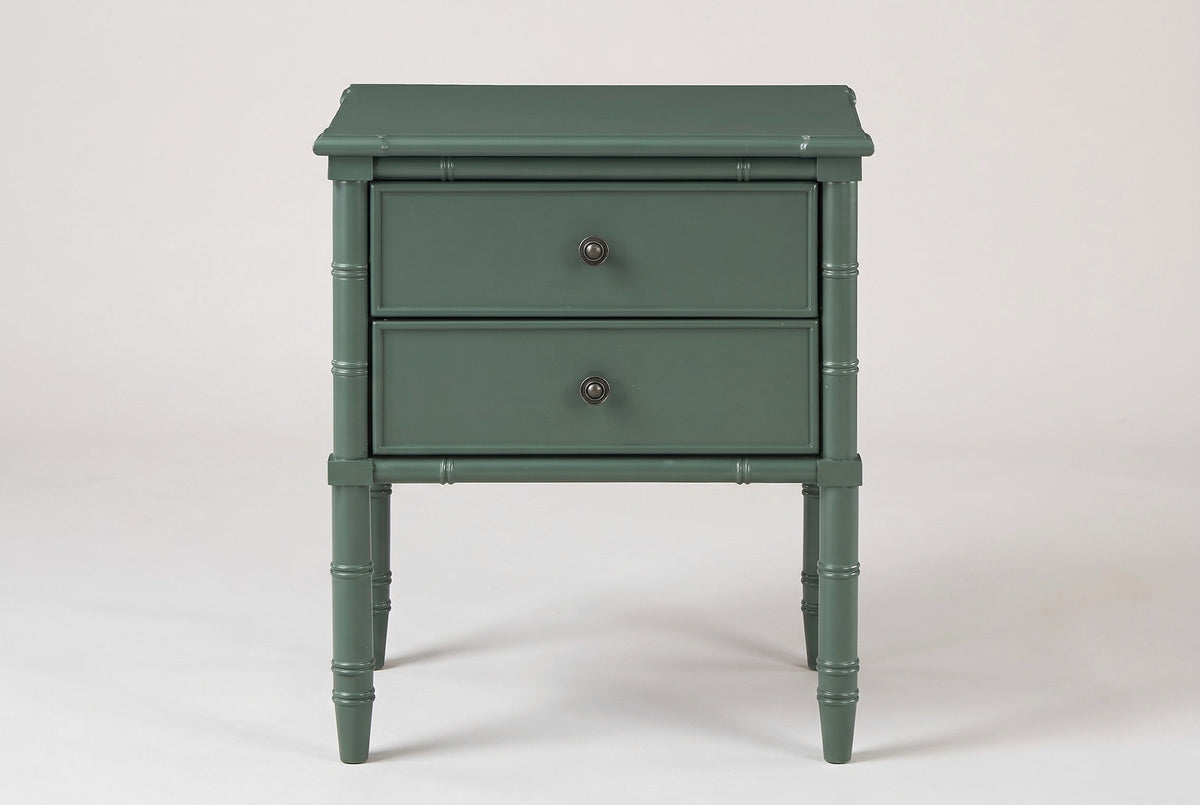 The Sorgono nightstand in vintage green, front view on a light studio backdrop