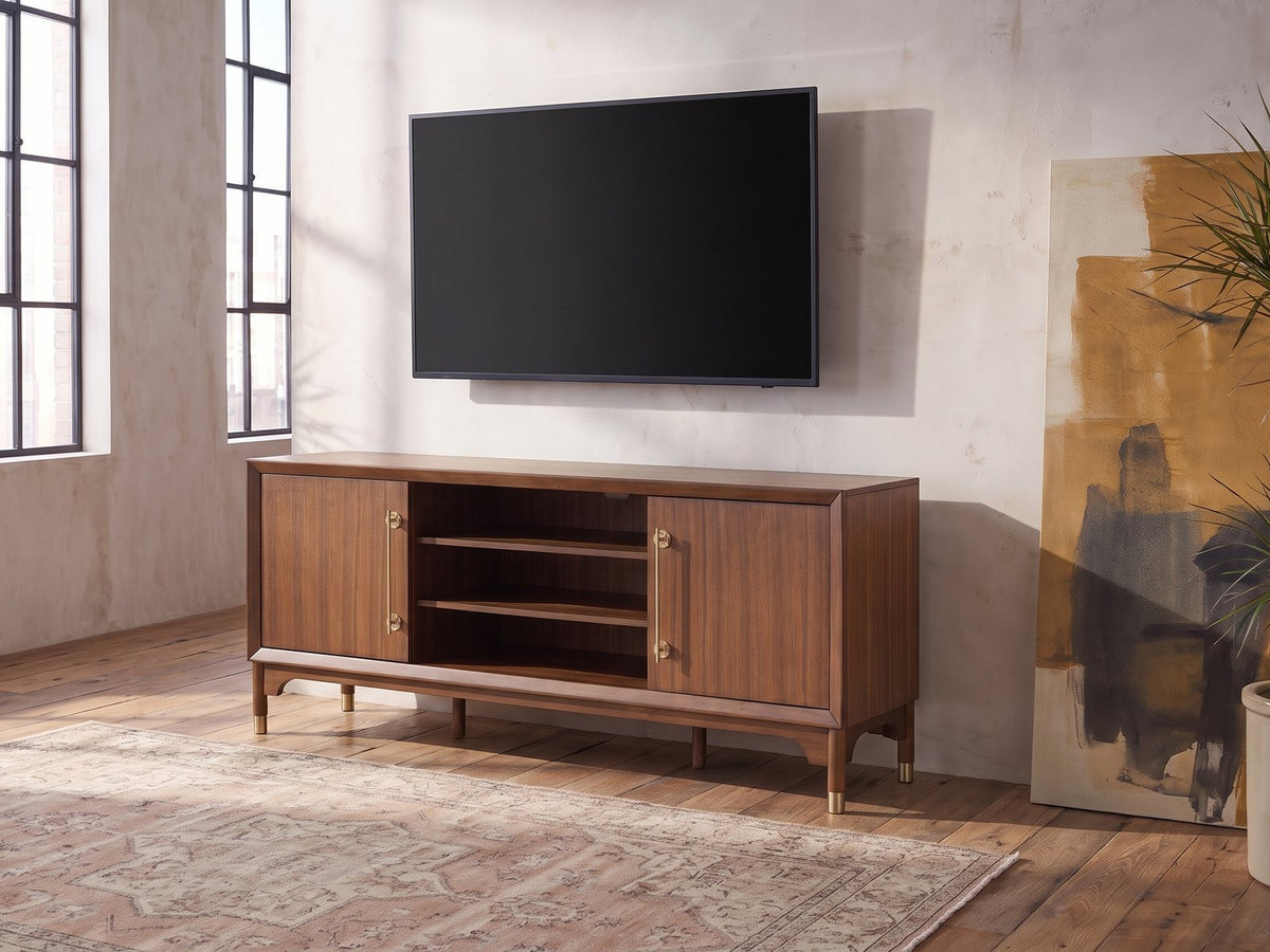 Stresa Walnut Media Console seen from the side, under a wall-mounted screen in an industrial loft