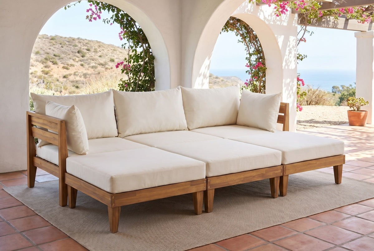 Stromboli acacia daybed set on a terracotta tile loggia in Santa Barbara, California, with white plaster arches, bougainvillea and a view of the sea (rug and plant not included)
