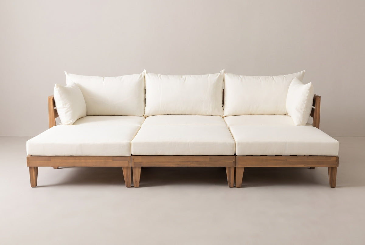 The Stromboli daybed set from the front: three sofas along the back with their cushions and pillows, and three ottomans in a row in front