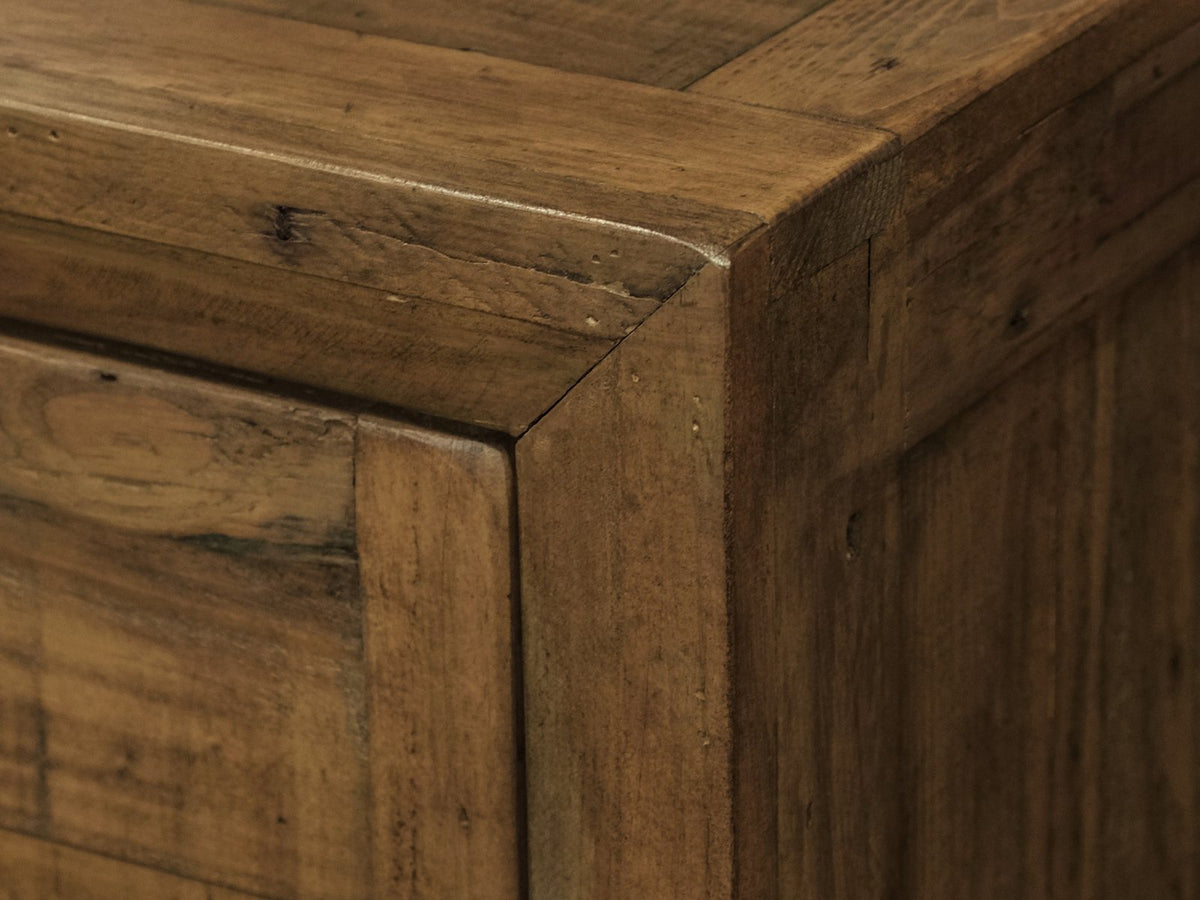 Close-up of the Tarvisio 37-Inch Rustic Caramel 5-Drawer Chest: corner