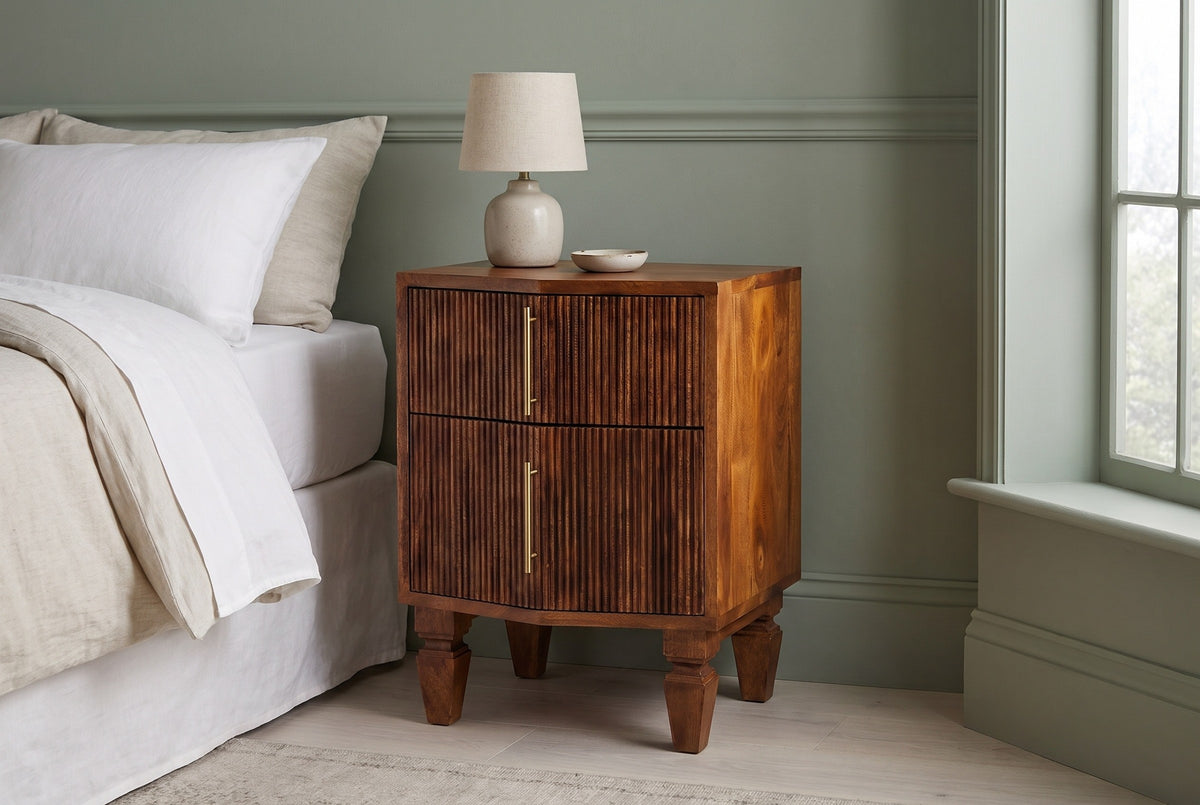 Teulada fluted mango nightstand against a sage green panelled wall in a Portland bedroom with a pale ash floor