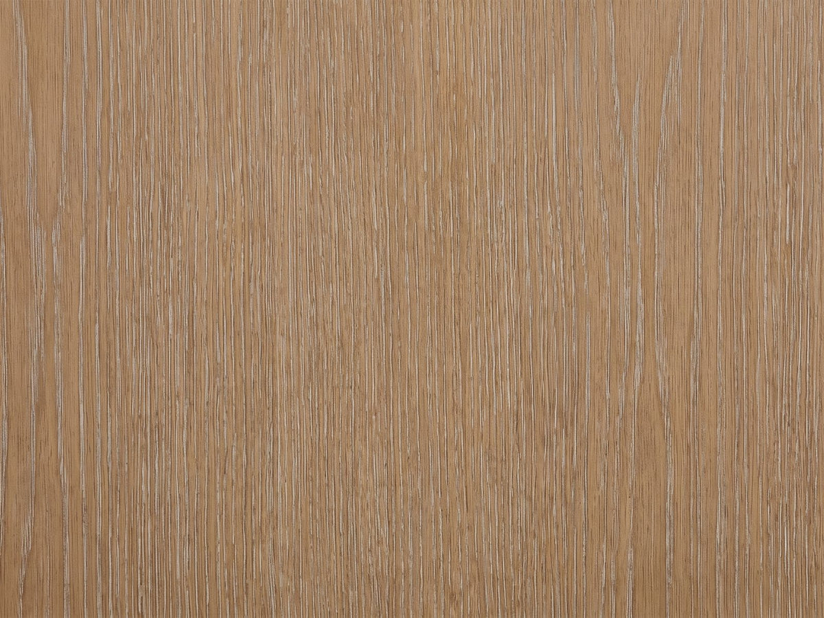 Close-up of the Thiene 66.5-Inch Toffee Oak Stone-Top 6-Drawer Dresser: the cerused toffee oak veneer of a drawer front