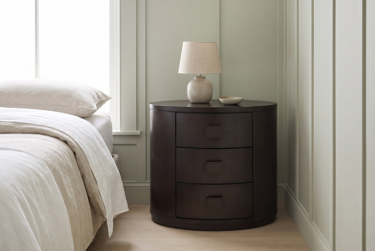 Tortoli espresso oval nightstand against pale sage board-and-batten walls in a Seattle bedroom