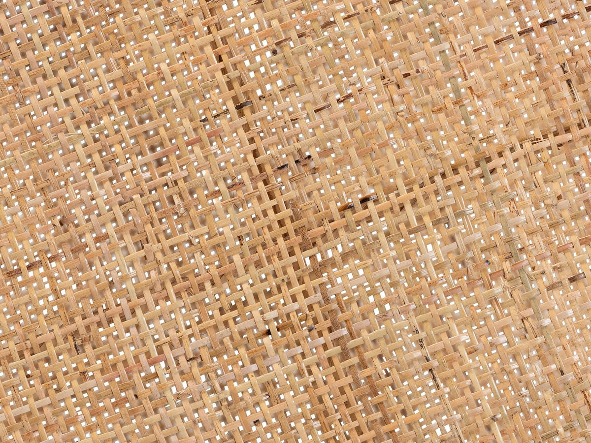 Close-up of the Valsinni Rattan Round Two-Tier Side Table: the woven rattan cane of the top