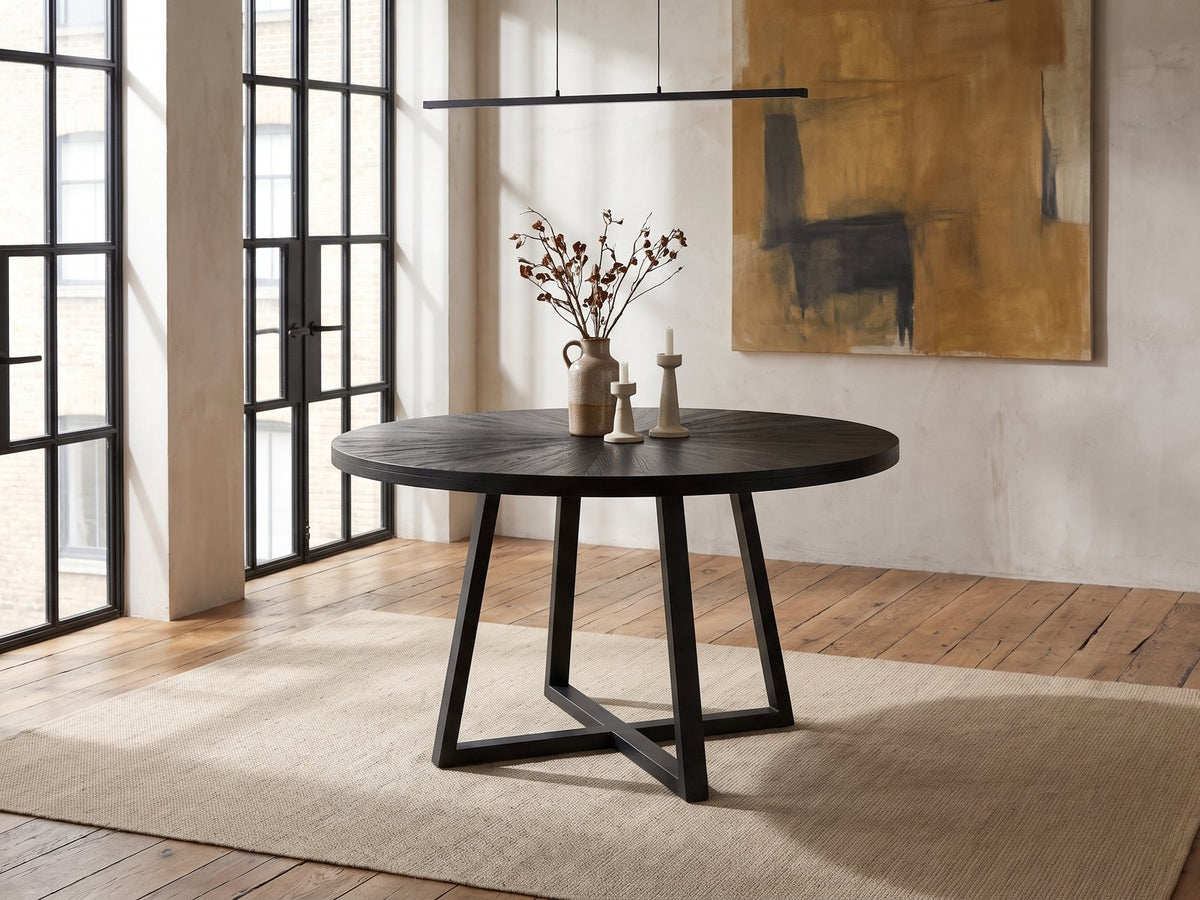 Verzino 47-Inch Round Black Acacia Sunburst Dining Table in an industrial loft dining area