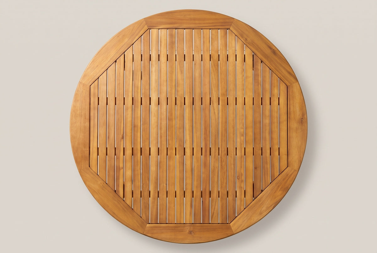 The Vittoria tabletop from directly above: a round acacia border of eight pieces around an octagon of 23 parallel slats