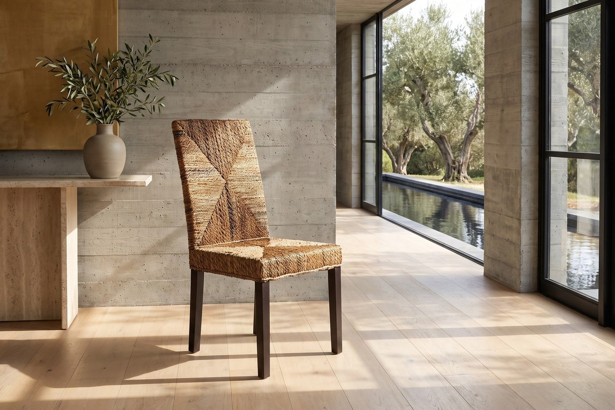 Zambrone Woven Natural Fiber Parsons Dining Chair in a sunlit villa dining room
