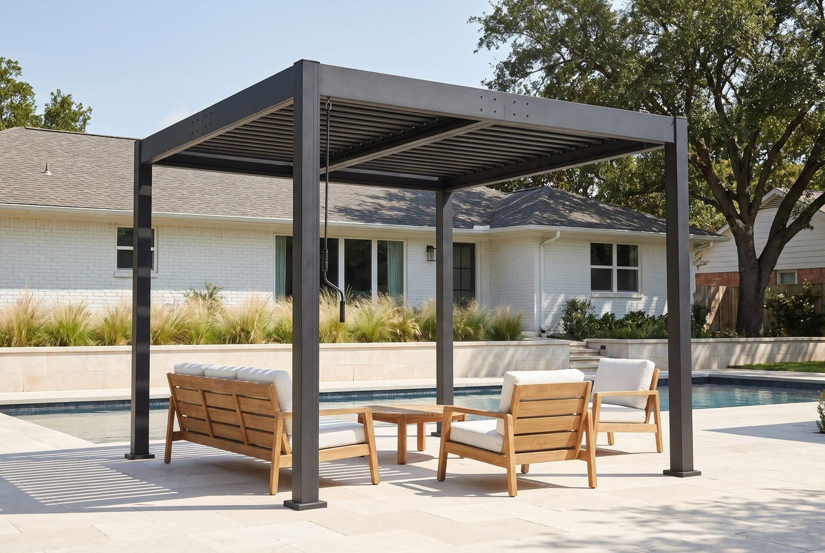 Zingaro black louvered pergola over a limestone pool patio behind a white brick ranch house in Houston, Texas (furniture not included)