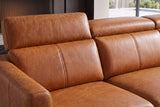 Close-up of Andria cognac leather seat cushions, adjustable headrests, and padded armrest