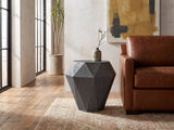 Accadia Grey Mango Faceted Octagon Side Table beside a cognac leather armchair in an industrial loft