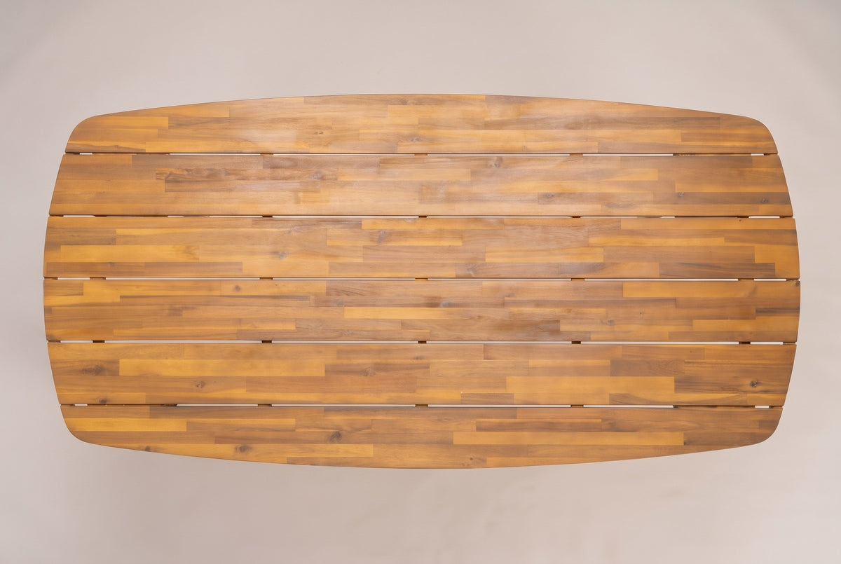 The Adrano dining table seen from directly above: the long top with rounded ends and six lengthwise acacia planks in a teak finish