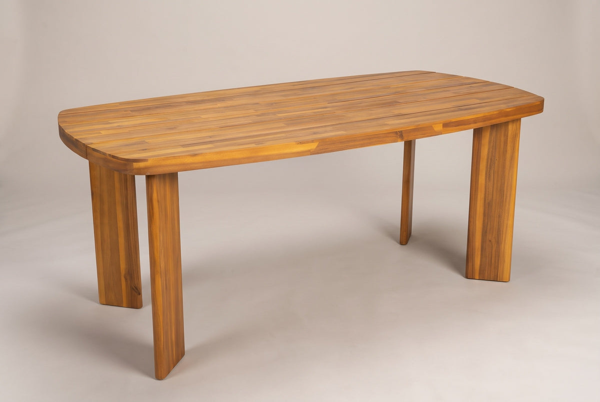 The Adrano acacia outdoor dining table in a teak finish, three-quarter view on a light studio backdrop