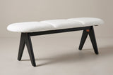 The Alatri bench with a white fabric seat and black legs, three-quarter view on a light studio backdrop
