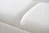Close-up of the white fabric seat of the Alatri bench: short, dense, nubby pile with a soft seam between two padded sections