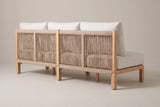 The Alcamo sofa from behind: the rope back panels between light teak back posts with bolt heads, the back cushions above and the square legs