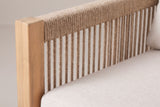 Close-up of the braided beige rope back and a light teak acacia post of the Alcamo sofa