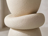 Close-up of the Altomonte Cream Fiberglass Stacked Side Table: the plump ring between the cup and the bell-shaped base